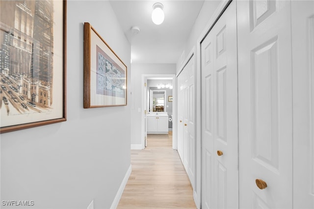 9636 Hemingway Ln Unit 4201, Fort Myers, FL 33913 - corridor with light wood-style flooring and baseboards