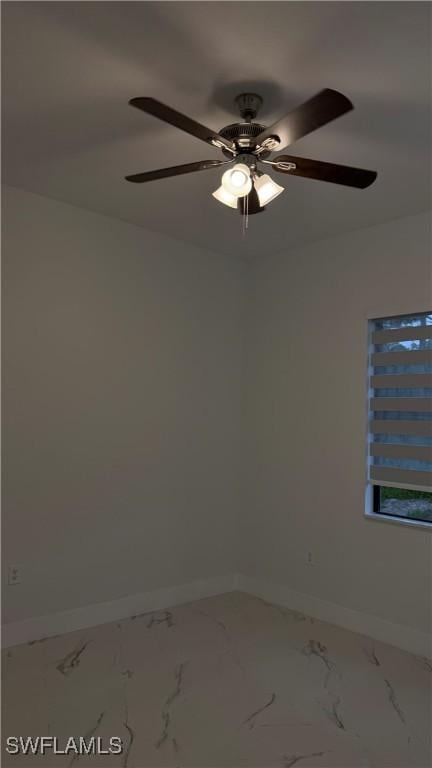 448 Majors Ave S, Lehigh Acres, FL 33974 - empty room featuring marble finish flooring and a ceiling fan
