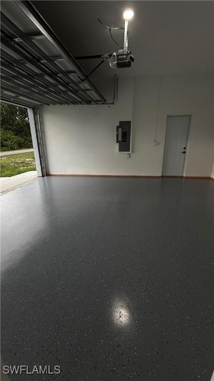 448 Majors Ave S, Lehigh Acres, FL 33974 - garage featuring a garage door opener and electric panel