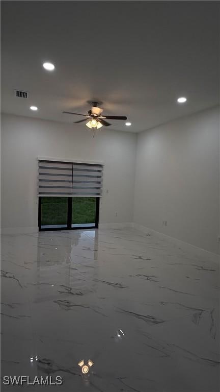 448 Majors Ave S, Lehigh Acres, FL 33974 - unfurnished room with marble finish flooring, a ceiling fan, and recessed lighting