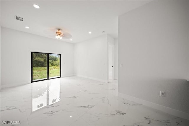 448 Majors Ave S, Lehigh Acres, FL 33974 - empty room featuring recessed lighting, light marble finish floors, and a ceiling fan