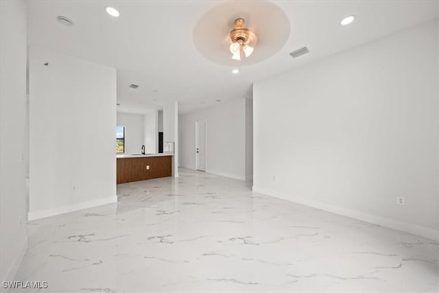 448 Majors Ave S, Lehigh Acres, FL 33974 - spare room with ceiling fan, light marble finish flooring, and recessed lighting