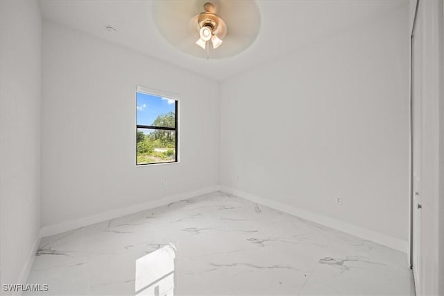 448 Majors Ave S, Lehigh Acres, FL 33974 - spare room featuring marble look tiles and a ceiling fan