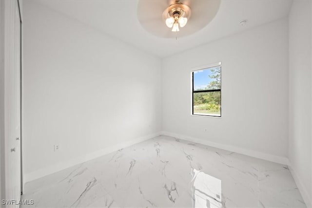 448 Majors Ave S, Lehigh Acres, FL 33974 - empty room featuring marble finish flooring and ceiling fan