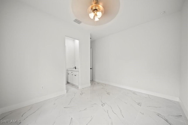 448 Majors Ave S, Lehigh Acres, FL 33974 - empty room with light marble finish flooring and a ceiling fan