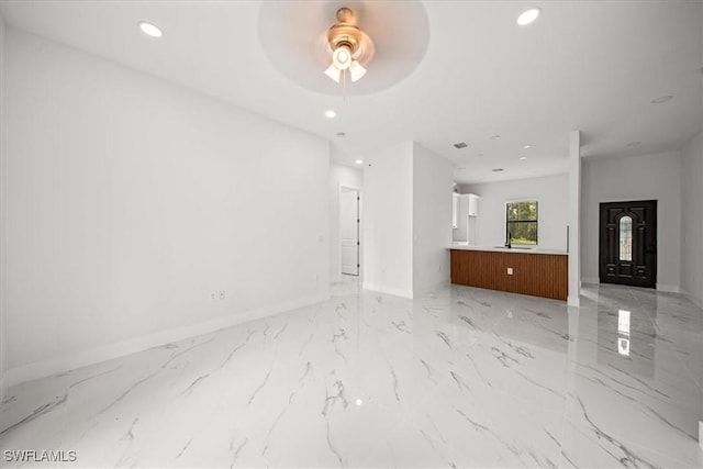 448 Majors Ave S, Lehigh Acres, FL 33974 - unfurnished living room with a ceiling fan, light marble finish flooring, and recessed lighting