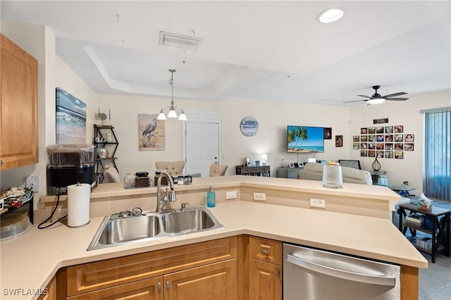 3939 Pomodoro Cir Unit 103, Cape Coral, FL 33909 - kitchen with stainless steel dishwasher, open floor plan, light countertops, a ceiling fan, and a tray ceiling