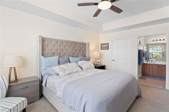 3939 Pomodoro Cir Unit 103, Cape Coral, FL 33909 - bedroom featuring light colored carpet, ensuite bath, and ceiling fan
