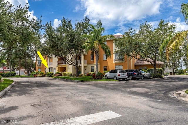 3939 Pomodoro Cir Unit 103, Cape Coral, FL 33909 - view of property with a residential view and uncovered parking