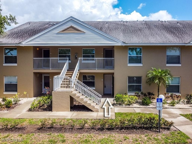 168 Pebble Shores Dr Unit 102, Naples, FL 34110 - view of building exterior featuring stairs