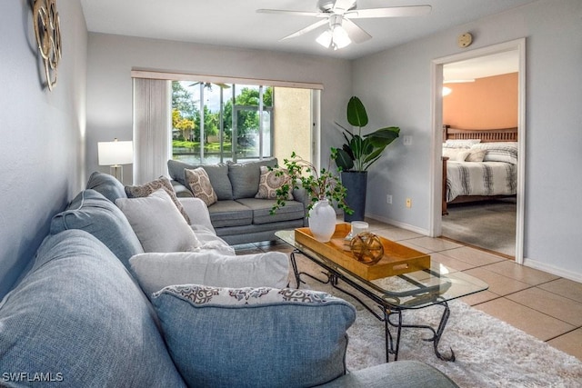 168 Pebble Shores Dr Unit 102, Naples, FL 34110 - living room featuring a ceiling fan and light tile patterned floors