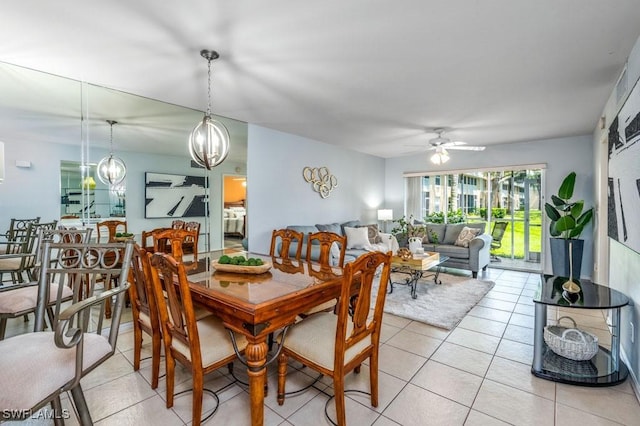 168 Pebble Shores Dr Unit 102, Naples, FL 34110 - dining space featuring a ceiling fan and light tile patterned floors