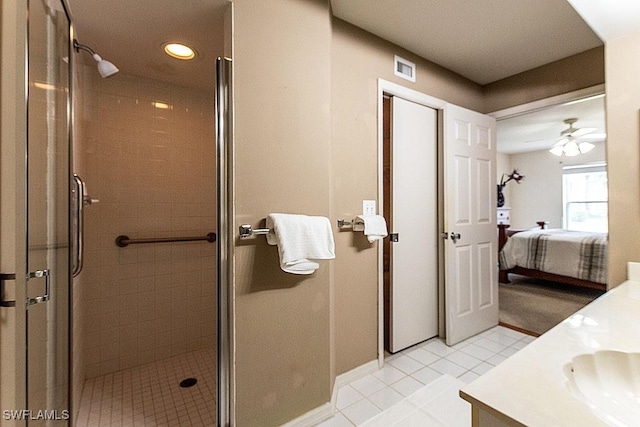 168 Pebble Shores Dr Unit 102, Naples, FL 34110 - ensuite bathroom featuring vanity, a stall shower, recessed lighting, a ceiling fan, and tile patterned flooring