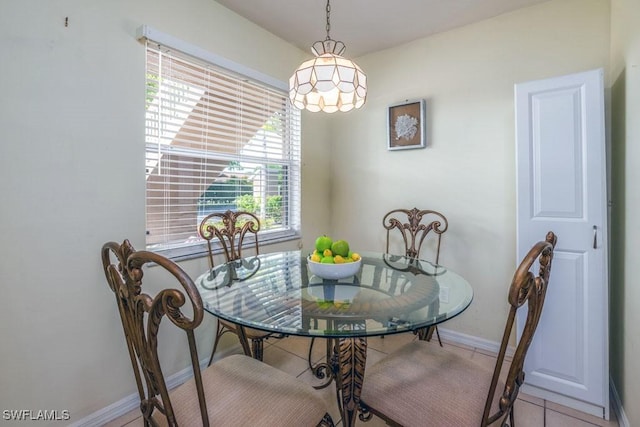 168 Pebble Shores Dr Unit 102, Naples, FL 34110 - dining area featuring baseboards and light tile patterned flooring
