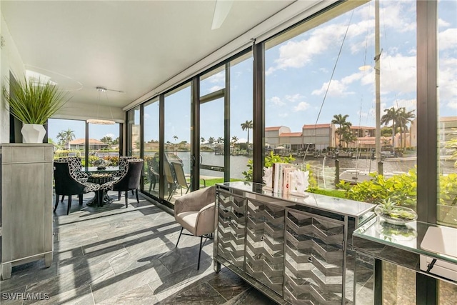4001 SE 19th Pl Unit B1, Cape Coral, FL 33904 - sunroom / solarium with a water view and expansive windows