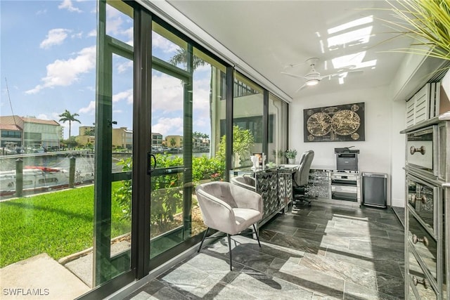 4001 SE 19th Pl Unit B1, Cape Coral, FL 33904 - sunroom featuring a wall of windows