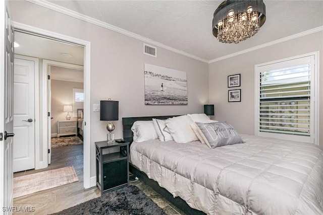 4001 SE 19th Pl Unit B1, Cape Coral, FL 33904 - bedroom featuring crown molding and a chandelier