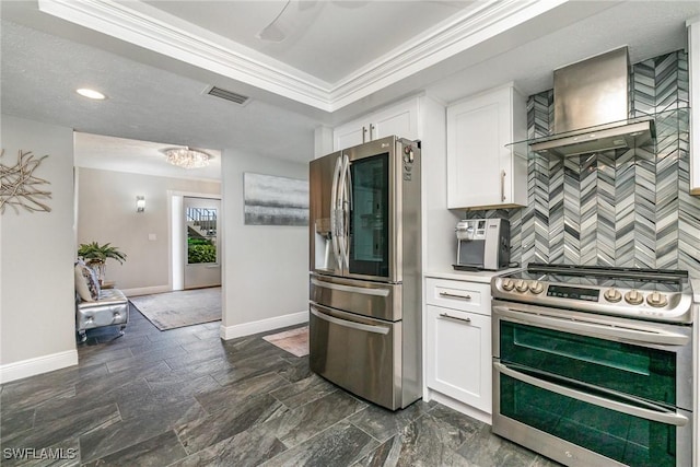4001 SE 19th Pl Unit B1, Cape Coral, FL 33904 - kitchen with appliances with stainless steel finishes, wall chimney range hood, white cabinetry, decorative backsplash, and crown molding
