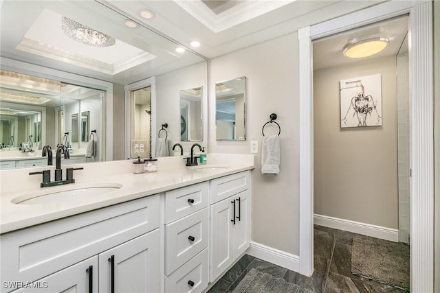 4001 SE 19th Pl Unit B1, Cape Coral, FL 33904 - bathroom featuring double vanity, recessed lighting, crown molding, and a tray ceiling
