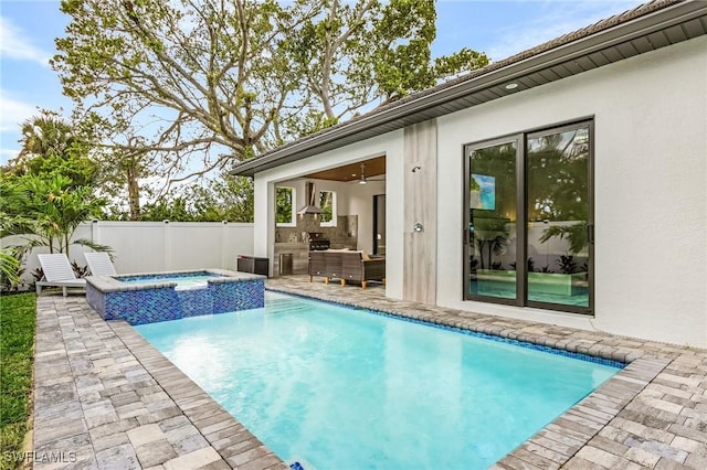 614 105th Ave N, Naples, FL 34108 - view of pool with a patio, a pool with connected hot tub, and an outdoor kitchen