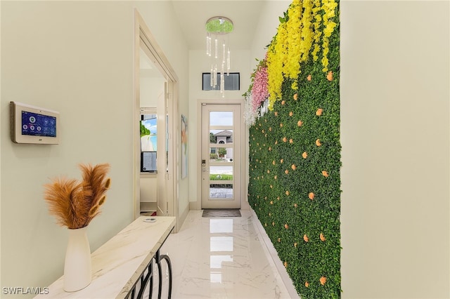 614 105th Ave N, Naples, FL 34108 - doorway to outside featuring light marble finish floors