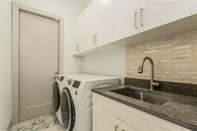 614 105th Ave N, Naples, FL 34108 - washroom featuring washing machine and clothes dryer, light marble finish flooring, and cabinet space