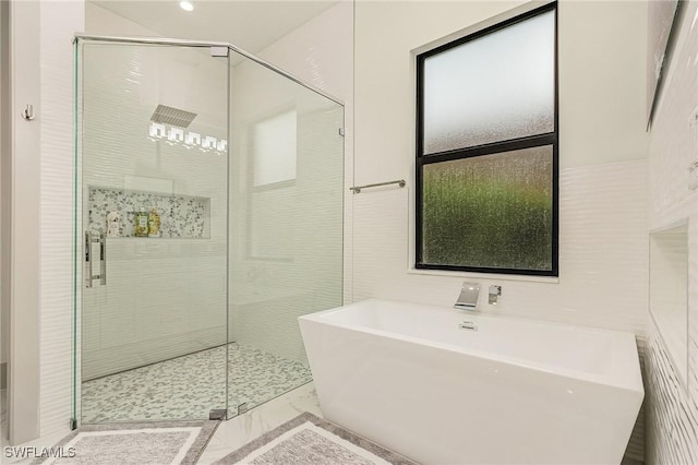 614 105th Ave N, Naples, FL 34108 - bathroom with a freestanding bath, a shower stall, marble finish flooring, and recessed lighting