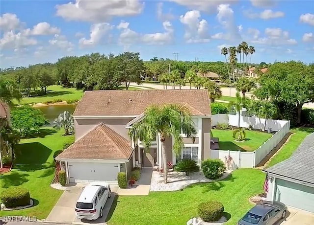 13356 Bristol Park Way, Fort Myers, FL 33913 - view of front of house featuring a garage, stucco siding, and a water view