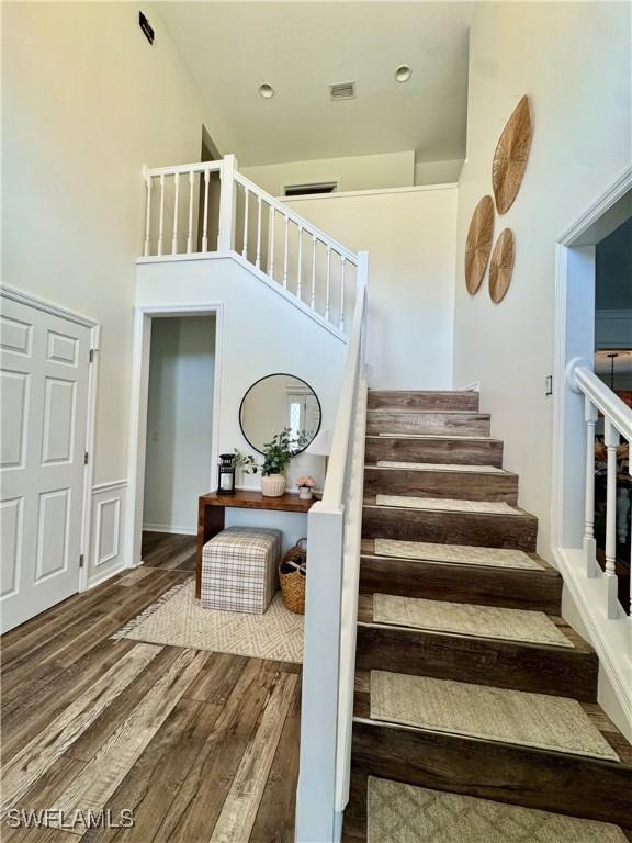 13356 Bristol Park Way, Fort Myers, FL 33913 - stairway with wood finished floors and a high ceiling