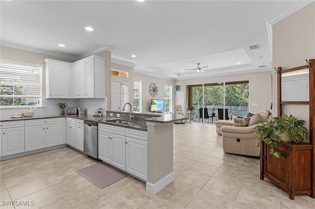 10406 Santiva Way, Fort Myers, FL 33908 - kitchen with dishwasher, a peninsula, a tray ceiling, open floor plan, and recessed lighting