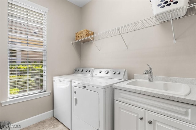 10406 Santiva Way, Fort Myers, FL 33908 - washroom with independent washer and dryer, cabinet space, and light tile patterned flooring