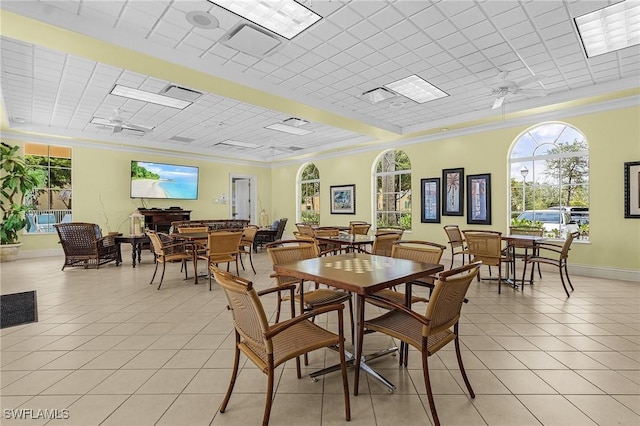 10406 Santiva Way, Fort Myers, FL 33908 - dining space featuring light tile patterned flooring, crown molding, ceiling fan, and a paneled ceiling