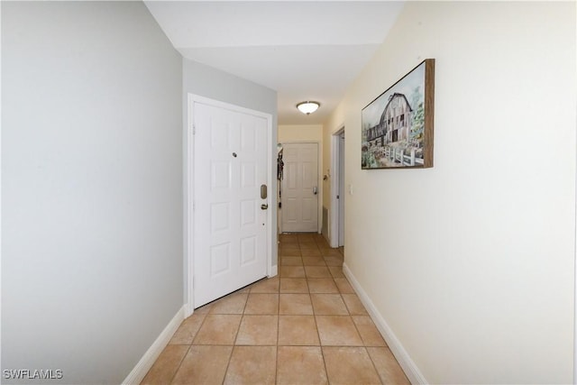 314 Melrose Pl Unit 33, Naples, FL 34104 - hall with light tile patterned floors and baseboards