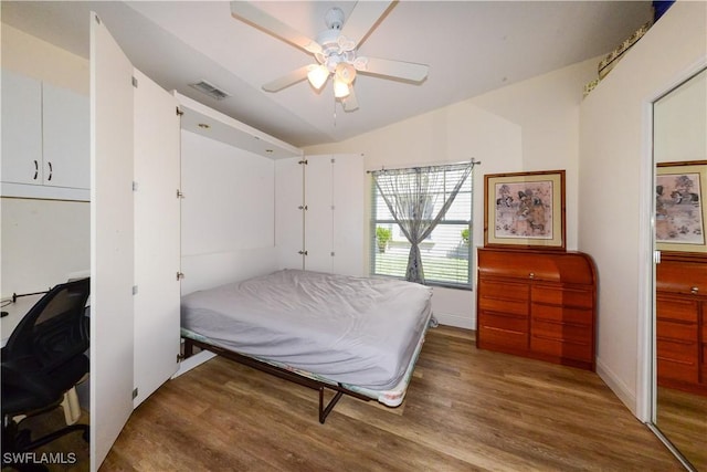 314 Melrose Pl Unit 33, Naples, FL 34104 - bedroom with wood finished floors, vaulted ceiling, and a ceiling fan