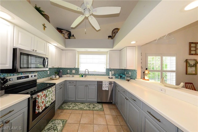 314 Melrose Pl Unit 33, Naples, FL 34104 - kitchen with appliances with stainless steel finishes, gray cabinetry, decorative backsplash, ceiling fan, and light tile patterned floors