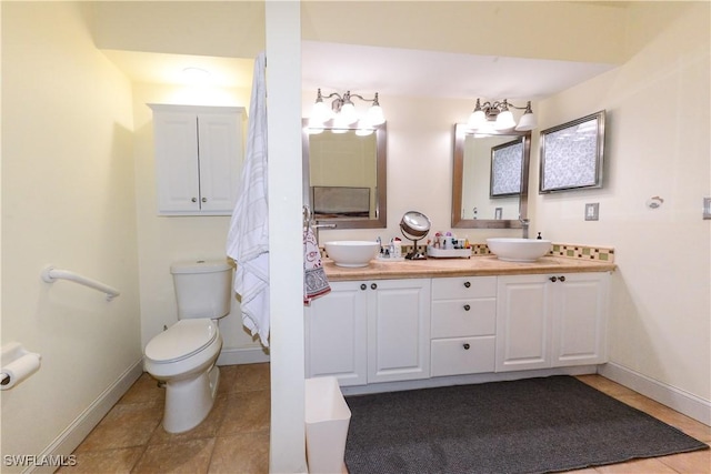 314 Melrose Pl Unit 33, Naples, FL 34104 - bathroom with double vanity and tile patterned floors