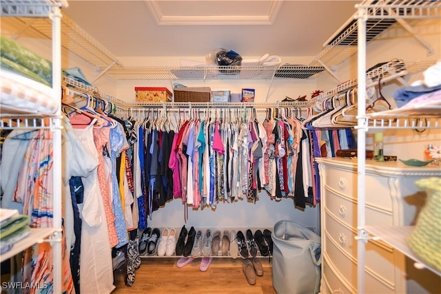 314 Melrose Pl Unit 33, Naples, FL 34104 - spacious closet featuring wood finished floors and a tray ceiling