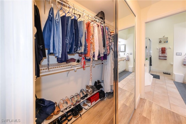 314 Melrose Pl Unit 33, Naples, FL 34104 - walk in closet with wood finished floors