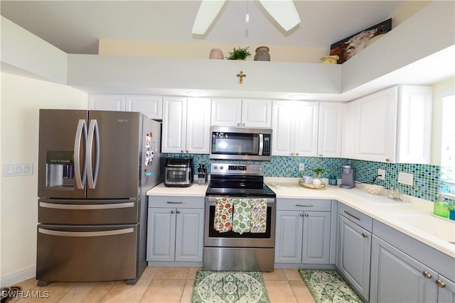 314 Melrose Pl Unit 33, Naples, FL 34104 - kitchen with appliances with stainless steel finishes, gray cabinets, tasteful backsplash, and light countertops