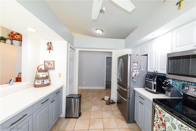 314 Melrose Pl Unit 33, Naples, FL 34104 - kitchen with stainless steel appliances, gray cabinetry, a ceiling fan, white cabinets, and light countertops