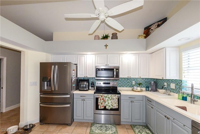 314 Melrose Pl Unit 33, Naples, FL 34104 - kitchen featuring appliances with stainless steel finishes, gray cabinets, tasteful backsplash, a ceiling fan, and light countertops