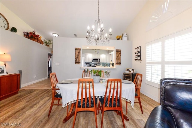 314 Melrose Pl Unit 33, Naples, FL 34104 - dining space featuring a chandelier and light wood finished floors
