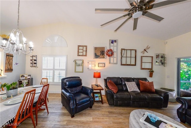 314 Melrose Pl Unit 33, Naples, FL 34104 - living room with light wood-style flooring, vaulted ceiling, a chandelier, and a ceiling fan