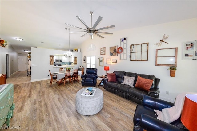 314 Melrose Pl Unit 33, Naples, FL 34104 - living room with a chandelier, wood finished floors, lofted ceiling, and a ceiling fan