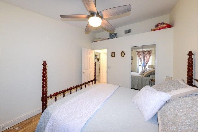 314 Melrose Pl Unit 33, Naples, FL 34104 - bedroom with wood finished floors, a closet, and a ceiling fan