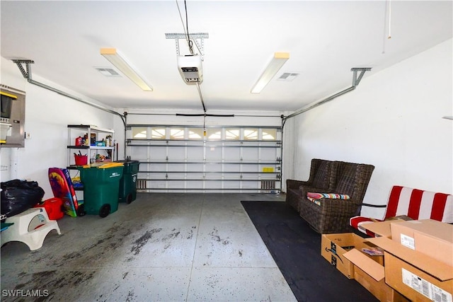 314 Melrose Pl Unit 33, Naples, FL 34104 - garage with a garage door opener