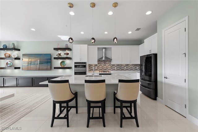 20368 Estero Crossing Blvd, Estero, FL 33928 - kitchen with wall chimney range hood, fridge with ice dispenser, double oven, decorative backsplash, and light countertops