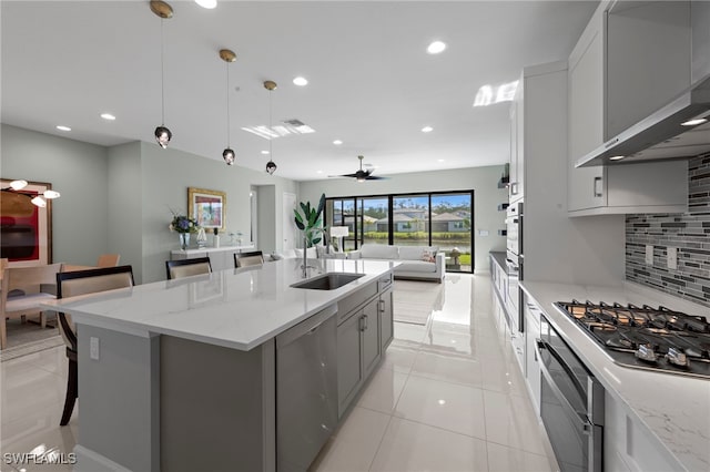 20368 Estero Crossing Blvd, Estero, FL 33928 - kitchen featuring appliances with stainless steel finishes, open floor plan, backsplash, recessed lighting, and light tile patterned floors