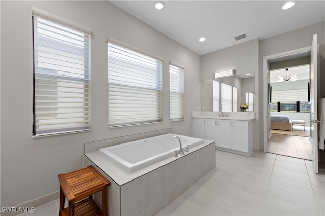 20368 Estero Crossing Blvd, Estero, FL 33928 - ensuite bathroom featuring a garden tub, vanity, tile patterned flooring, and recessed lighting