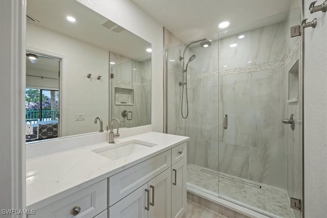60 Emerald Woods Dr Unit B11, Naples, FL 34108 - ensuite bathroom with a stall shower, recessed lighting, and vanity